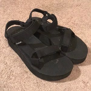Black Teva flatforms